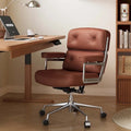 Fauteuil de bureau ergonomique en cuir capitonné à dossier mi-haut avec accoudoirs chromés